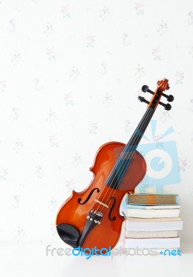 Violin And Book In Living Room Stock Photo