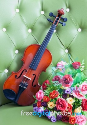 Violin With Artificial Roses Flower Bouquet Stock Photo