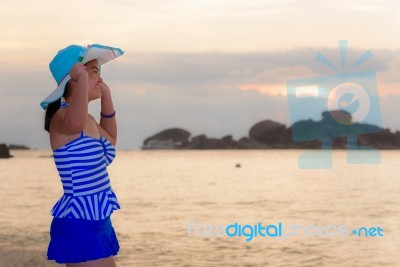 Visitors Woman Looking The Sunrise Over The Sea Stock Photo