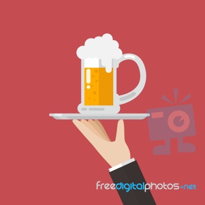 Waiter Serving A Glass Of Beer Stock Image