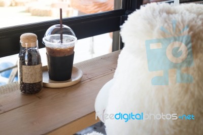 Waiting Bear Doll Sit In The Coffee Shop Stock Photo