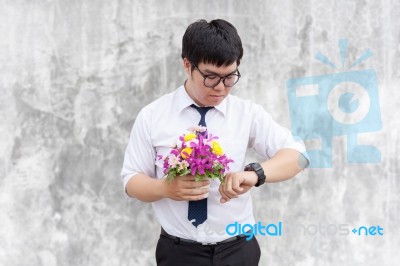 Waiting For His Girlfriend. Close Up Of Handsome Young Man Holdi… Stock Photo