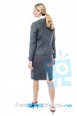 Walking Businesswoman, Back View Stock Photo