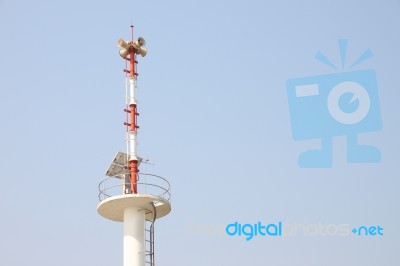 Warning Tower Tsunami On Blue Sky Stock Photo