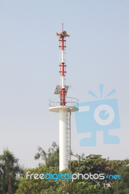 Warning Tower Tsunami On Forest Beach Stock Photo