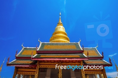 Wat Phrathat Hariphunchai Golden Pagoda In Lamphun,thailand Stock Photo