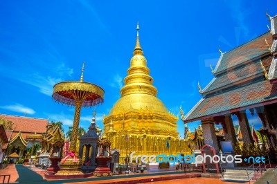 Wat Phrathat Hariphunchai Golden Pagoda In Lamphun,thailand Stock Photo