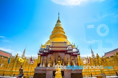 Wat Phrathat Hariphunchai Golden Pagoda In Lamphun,thailand Stock Photo