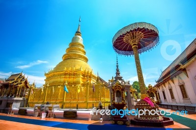 Wat Phrathat Hariphunchai Golden Pagoda In Lamphun,thailand Stock Photo