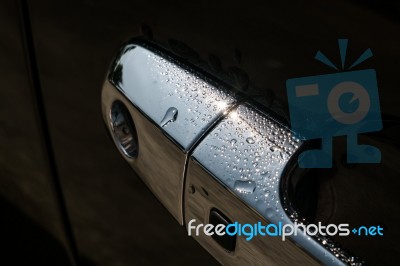 Water Drops On Car Door Handle Stock Photo