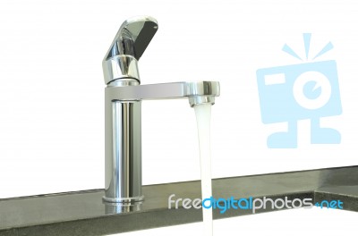 Water Flow Faucet Granite Counter On White Background Stock Photo