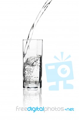 Water Flowing Into A Tall Glass With Its Reflection Isolated On Stock Photo