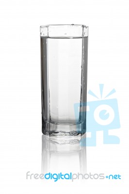 Water In A Tall Glass With Its Reflection Isolated On White Back… Stock Photo