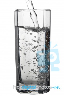 Water Pouring Into A Tall Glass, Closeup View, Isolated On White… Stock Photo