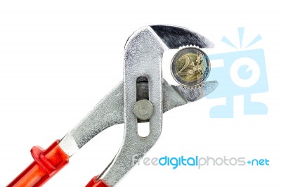 Water Pump Pliers Holding Two Euro Coin On White Background Stock Photo