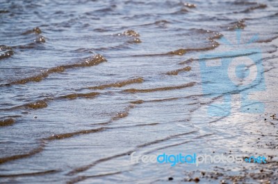 Water Shoreline On The Beach Stock Photo