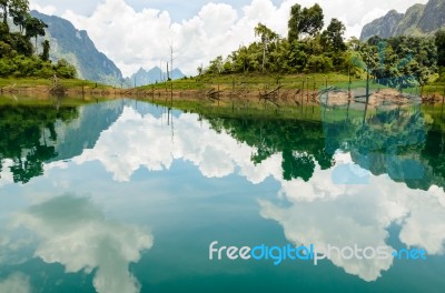 Water Surface Reflecting Sky And Cloud Stock Photo