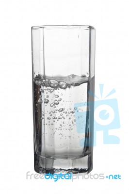 Water With Air Bubbles In A Tall Glass Isolated On White Backgro… Stock Photo