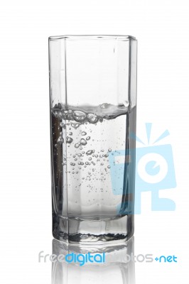 Water With Air Bubbles In A Tall Glass With Its Reflection Isola… Stock Photo