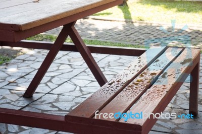 Waterdrops On Bench In Summer Stock Photo