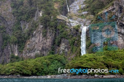 Waterfall At Milford Sound Stock Photo