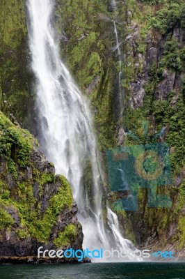 Waterfall At Milford Sound Stock Photo