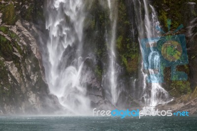 Waterfall At Milford Sound Stock Photo