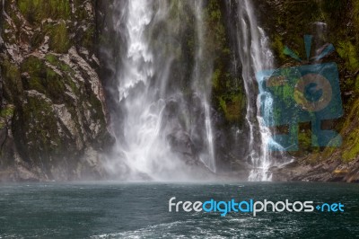 Waterfall At Milford Sound Stock Photo