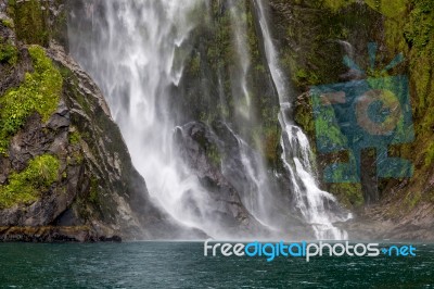 Waterfall At Milford Sound Stock Photo