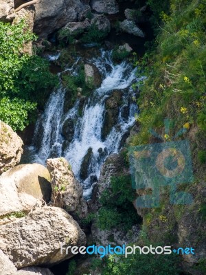 Waterfall Below The New Bridge At Ronda Spain Stock Photo