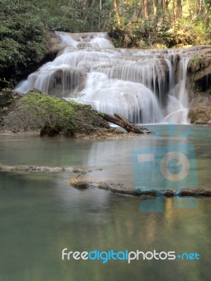 Waterfall That Flows Down To The Floor Stock Photo