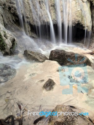 Waterfall With Water Flowing Around Stock Photo