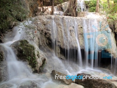 Waterfall With Water Flowing Around Stock Photo