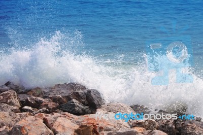 Wave Crash Against With Rock Beach Stock Photo