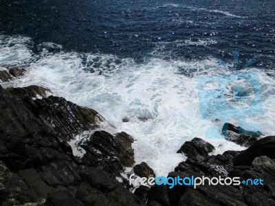 Waves Crashing On The Rocks B Stock Photo