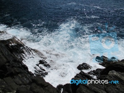 Waves Crashing On The Rocks D Stock Photo