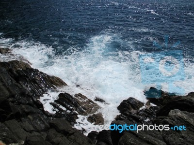 Waves Crashing On The Rocks E Stock Photo