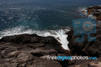 Waves Crashing On The Rocks L Stock Photo