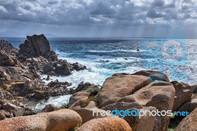 Waves Pounding The Coastline At Capo Testa Sardinia Stock Photo