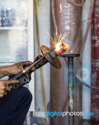 Welders Were Repairing Shock Absorbers Stock Photo