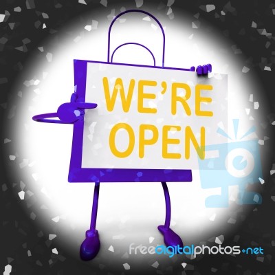 We're Open Sign On Shopping Bag Shows New Store Launch Or Openin… Stock Image