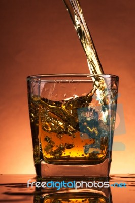 Whiskey Splash In A Glass Stock Photo