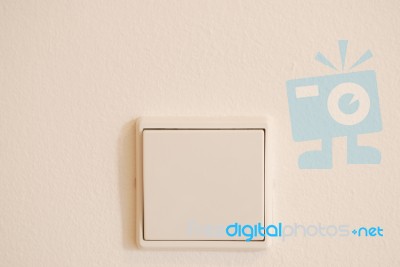 White And Modern Light Switch On Wall Stock Photo