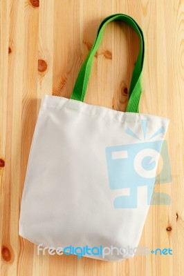 White Bag On Wood Background Stock Photo