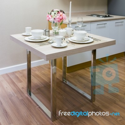 White Ceramic Bowl On Wooden Table Stock Photo