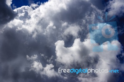 White Clouds In The Bright Blue Sky Stock Photo