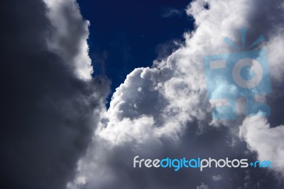 White Clouds In The Bright Blue Sky Stock Photo