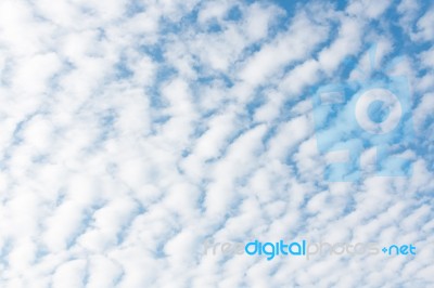 White Clouds On Blue Sky Background Stock Photo