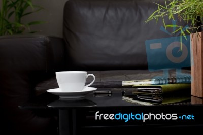 White Coffee Cup On Glass Table Stock Photo