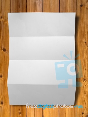 White Crumpled Paper On Wood Stock Photo